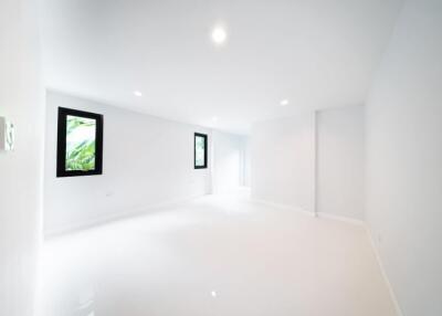 Spacious and bright white room with windows