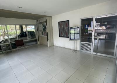 Lobby area with tiled flooring and seating