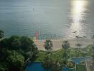 view of ocean and swimming pool from high-rise building