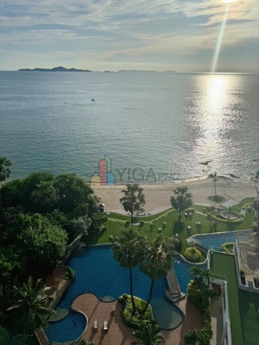 view of ocean and swimming pool from high-rise building