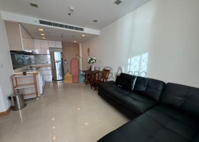 Living room with open kitchen and dining area