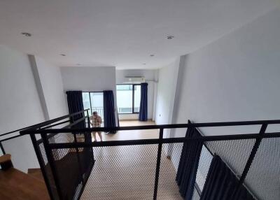 Modern loft with a mezzanine and large windows