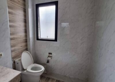 Modern bathroom with wooden accents