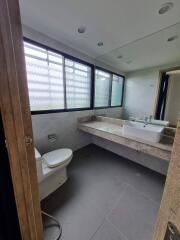 Elegant bathroom with large mirror and modern fixtures