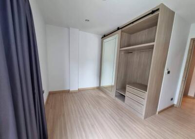 Bedroom with wooden floor and built-in closet