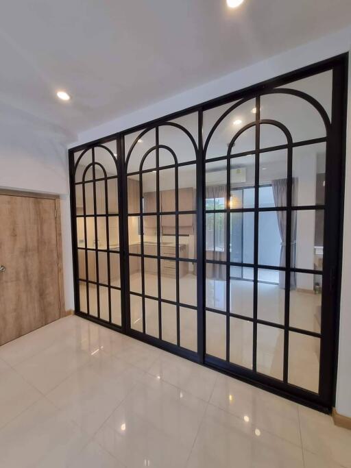 Spacious living area with large glass doors