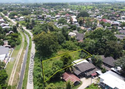 Aerial view of a property and surrounding neighborhood