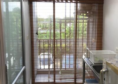 Small kitchen with window and sliding glass doors