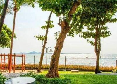 Oceanfront yard with trees and sea view