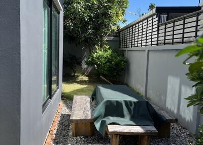 Outdoor seating area with table and benches