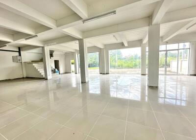 Spacious main living area with large windows