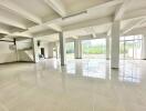 Spacious main living area with large windows