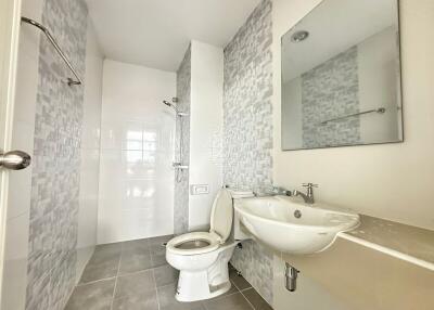 Modern bathroom with tiled walls and fixtures