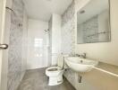 Modern bathroom with tiled walls and fixtures