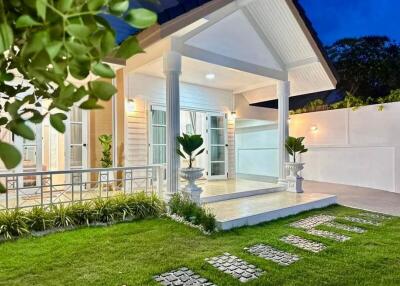 Front view of a house with porch and green lawn