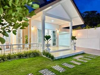 Front view of a house with porch and green lawn