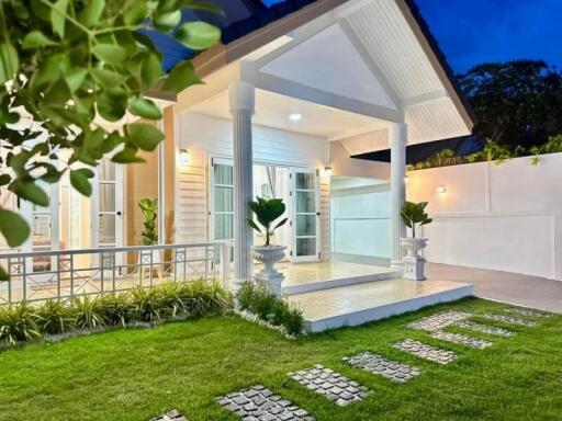 Front view of a house with porch and green lawn