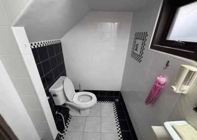 Small bathroom with angled ceiling