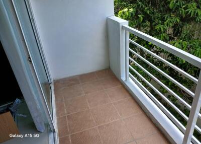 Small balcony with tiled floor and greenery view