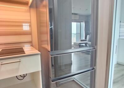 Modern kitchen with stainless steel refrigerator