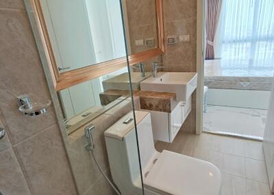 Modern bathroom with glass shower and white fixtures