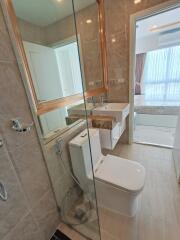 Modern bathroom with glass shower and white fixtures