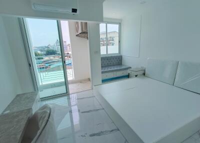 Spacious and Bright Main Living Area with Balcony Access