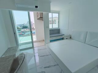 Spacious and Bright Main Living Area with Balcony Access