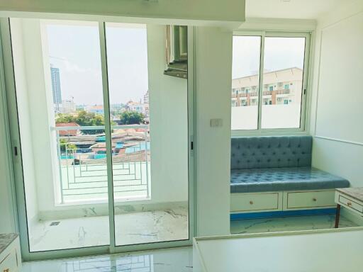 A bright living area with large windows and a view