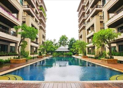 Beautiful outdoor pool area between apartment buildings