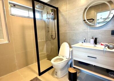 Modern bathroom with shower and floating vanity