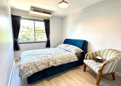 Bright and cozy bedroom with a large window