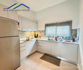 Modern kitchen with appliances and cabinets