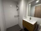 Modern bathroom with shower area and sink