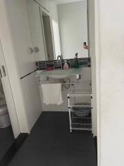 Modern bathroom with sink and storage rack