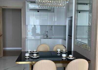 Modern kitchen and dining area with chandelier