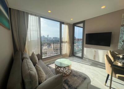 Modern living room with large windows and city view