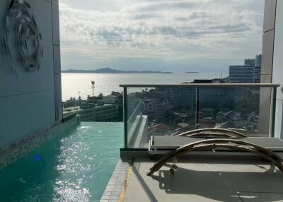 Balcony with pool and ocean view