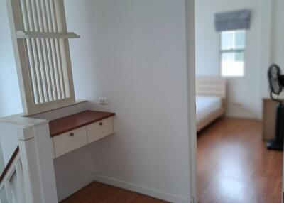 Bedroom with wooden floors and a window