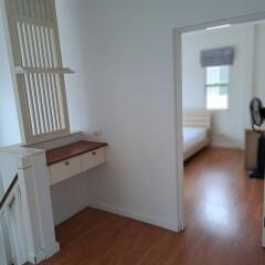 Bedroom with wooden floors and a window