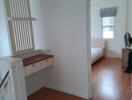 Bedroom with wooden floors and a window