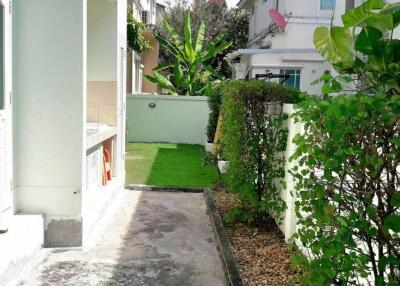 Side view of a residential building with garden