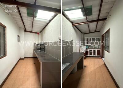 Simple kitchen with wash area and overhead natural lighting