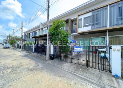 Residential building with multiple units and outdoor fencing