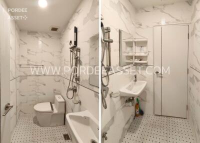 Modern bathroom with white marble tiles and sanitary fixtures