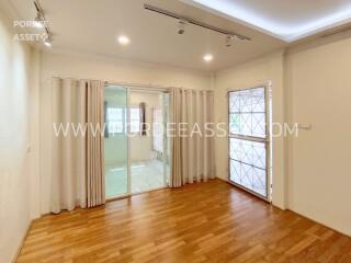 Bright and spacious living room with wooden flooring