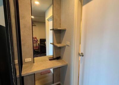 Hallway with mirror and shelves