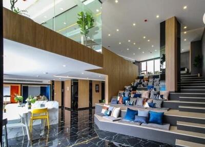 Modern living room with tiered seating and dining area