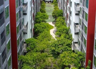 Luxury apartment complex with lush courtyard