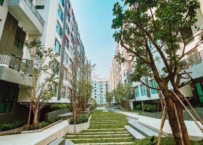 Modern apartment buildings with landscaped entrance